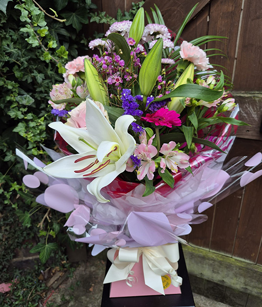 Simply Flowers Hand Tied Flowers with Lilies